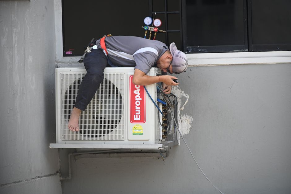 Professional air conditioning installation in a modern home